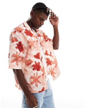 ASOS DESIGN boxy oversized revere shirt with floral print in pink