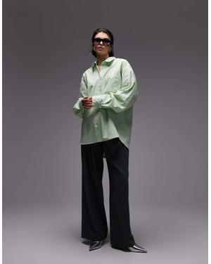 ASOS DESIGN oversized skjorta med knappdetalj bak i grön