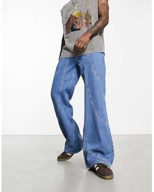 ASOS DESIGN vida utsvängda jeans i medelblå tvätt