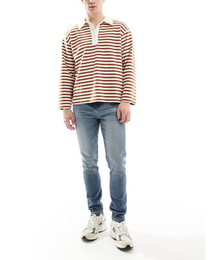 ASOS DESIGN smala jeans i medelblå tvätt