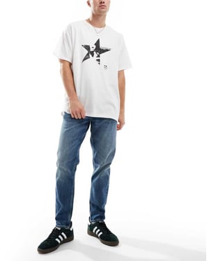 ASOS DESIGN stretch tapered jeans i ljus tvättad blå