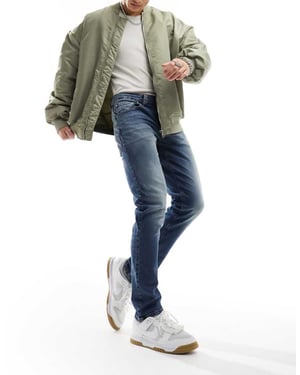 ASOS DESIGN stretch slim jeans i tonad blå