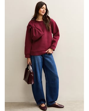 Jersey oversize con parche de lazo rojo
