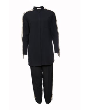 Chloé, Donkerblauwe broek (36/XS) en blouse (38/S) met zilveren borduursel langs de mouwen en benen.