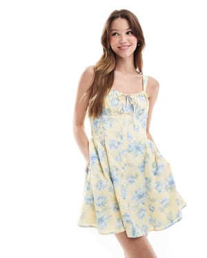 Hollister mjölkpiga drop waist knapprad ärmlös mini-klänning i blått blommönster