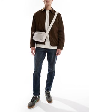 ASOS DESIGN stretch tapered med toning i mörk tvättad blå
