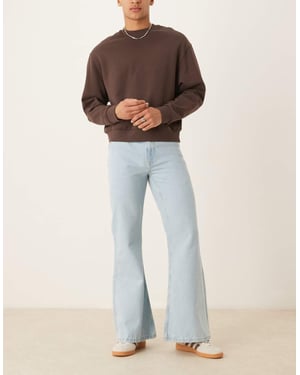 ASOS DESIGN vida utsvängda jeans i blekt blå