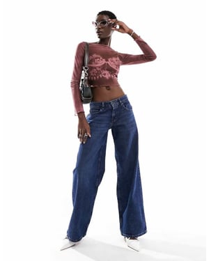 Motel extra wide low rise jeans in mid blue used wash