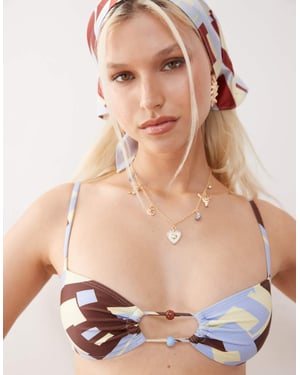 Återvunnet vintage bralette-bikinitopp med utskärningar och pärlor i brun och blå geometrisk tryck