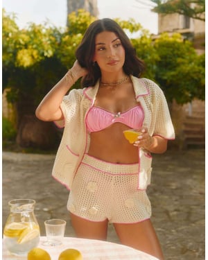 The Frolic x Lydia Kara exclusive floral crochet contrast trim beach shorts co-ord in cream and pink