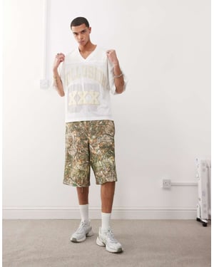 COLLUSION Skater avkopplande jersey-shorts i trädkamouflage-mönster - MULTI