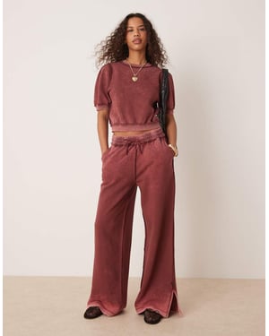 ASOS DESIGN exponerad söm joggerset i tvättad burgundy