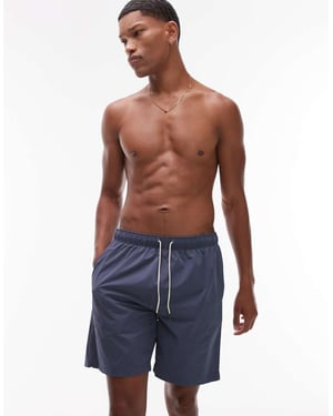 ARKET mellanlånga dragsko badshorts i mellanblå