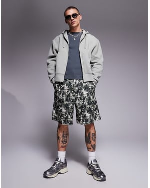 Armani Exchange shorts in green palm print