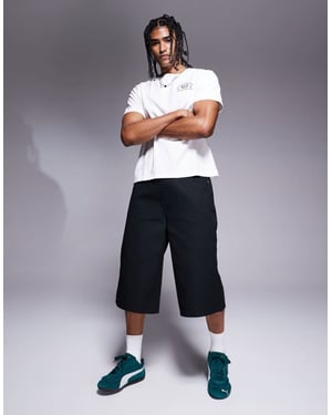 ASOS DESIGN längre shorts i svart
