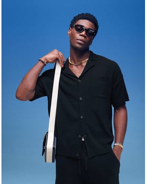 ASOS DESIGN oversized passform lätt texturerad knäppning polo co-ord i svart