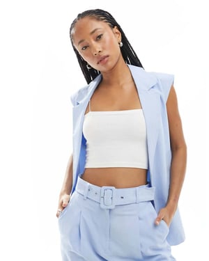 ASOS DESIGN ärmlös skräddarsydd blazer i linne i ljusblått