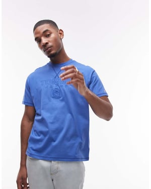 Tommy Jeans tonal sköld t-shirt i blått