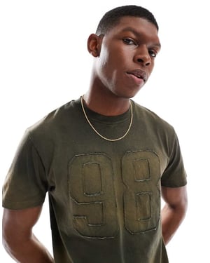 ASOS DESIGN tung boxig t-shirt i tvättad grön med nummersymsel