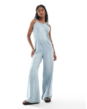 Monki lightweight denim halter neck jumpsuit in blue wash