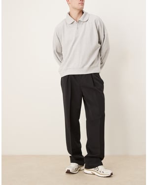 ASOS DESIGN smart vida byxor med framåtvända veck i svart med elastisk midja