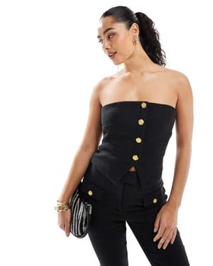 The Frolic exclusive tailored boucle bandeau split front gold flower button detail top co-ord in black