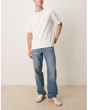 ASOS DESIGN baggy fit jeans i mellanblå tvätt