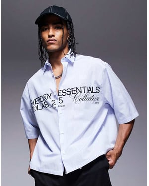 ASOS DESIGN boxig oversized poplin-skjorta med grafik i marinblått