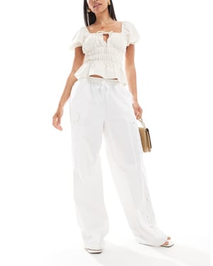Pieces embroidered wide leg trousers in white