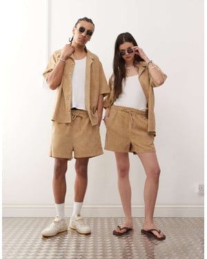 Återvunnet vintageshorts av kord i brunt för unisex