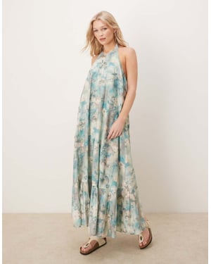 ASOS DESIGN halterneck maxiklänning med volangkant i suddig blommig tryck