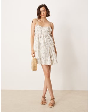 ASOS DESIGN babydoll miniklänning med volangkant i småblommig tryck