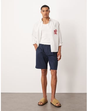 ASOS DESIGN raka chinoshorts i marinblå linneutseende