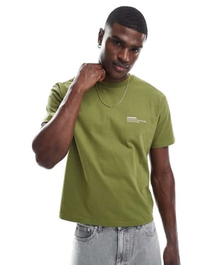 Dr Denim kortärmad T-shirt med rundad hals och loggrafik i grön
