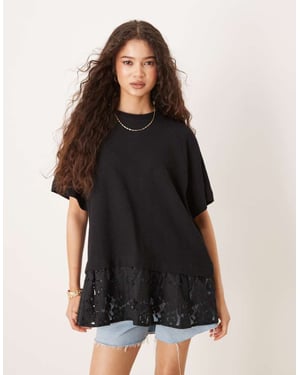 ASOS DESIGN oversized raglan t-shirt med spetsdetalj i svart