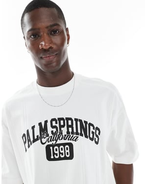 ASOS DESIGN tung boxig oversized t-shirt med stadsgrafik i tungt brett ribbat tyg i vitt
