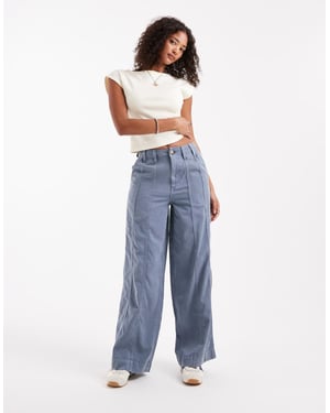 ASOS DESIGN sömda vida byxor i tvättad blå