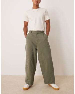 ASOS DESIGN överdimensionerade baggy byxor i khaki med snickardetaljer