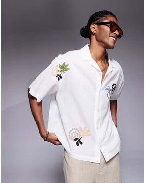 ASOS DESIGN oversized skjorta med revers och tryck i vit
