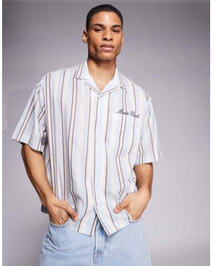 ASOS DESIGN oversized skjorta med broderi på bröstet i blå och brun rand