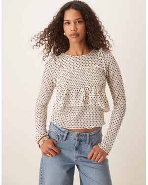 ASOS DESIGN långärmad topp med spagettibandsoverlägg i prickmönster