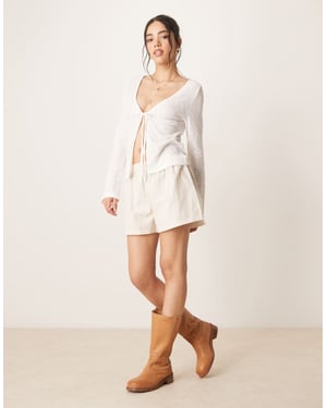 ASOS DESIGN stickad look slips-fram långärmad topp i krämfärg