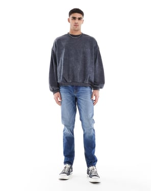 ASOS DESIGN skinny jeans med ton i mellannyans blå