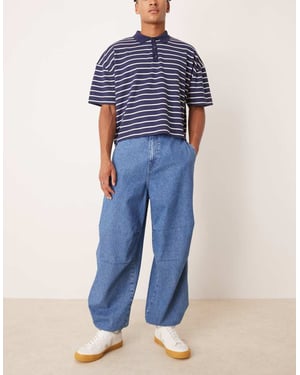ASOS DESIGN oversized fallskärmjeans med dragsko och kontrastsöm i mellanblå tvätt