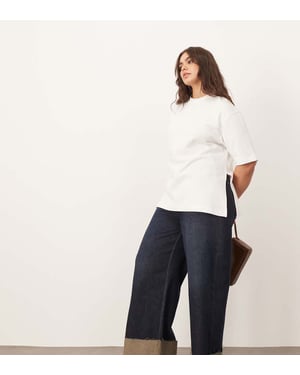 ARRANGE Curve Parker denim hög midja slouchy uppvikta jeans i indigo