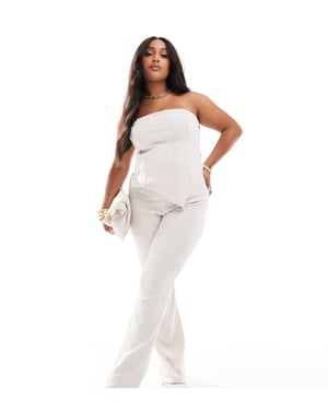 ASOS DESIGN Curve co-ord ribbed flare trousers in cream