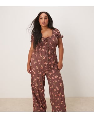 ASOS DESIGN Curve spun lace trim korsett midja jumpsuit i milda blommor