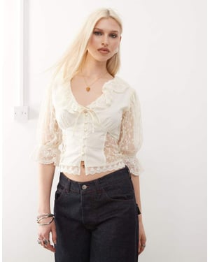 Återanvänd vintage western-knappad t-shirt med blommor i elfenben