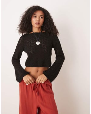 ASOS DESIGN stickad topp med utsvängda ärmar i sömdetalj i svart