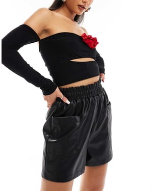 In The Style leather look stretch waist shorts in black